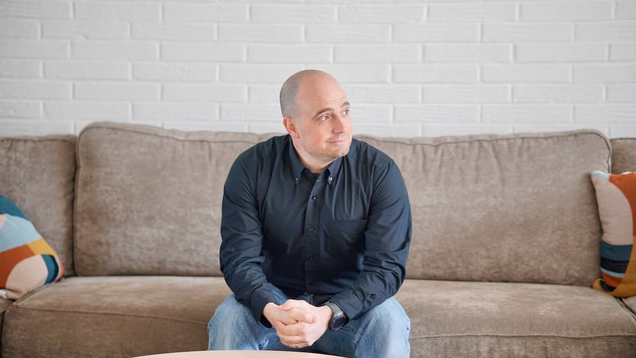 Roy Lucier seated, listening — a working session.